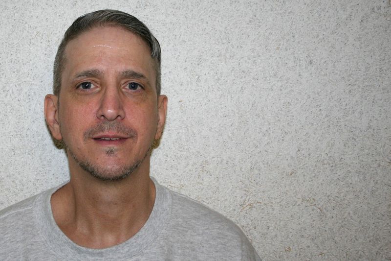 © Reuters. FILE PHOTO: Oklahoma death row inmate Richard Glossip, who is challenging his conviction in a 1997 murder-for-hire plot, poses for a photograph taken by his attorney in U.S., in 2016. Don Knight/Handout via REUTERS/File Photo