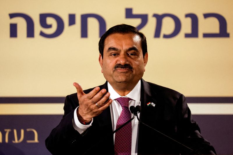 © Reuters. FILE PHOTO: Indian billionaire Gautam Adani speaks during an inauguration ceremony after the Adani Group completed the purchase of Haifa Port earlier in January 2023, in Haifa port, Israel January 31, 2023. REUTERS/Amir Cohen/File Photo